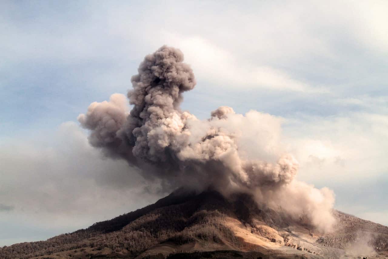 Mount Sinabung spews hot lava and volcanic ash as it is seen from Tiga Pancur Village, Karo, North Sumatra, Indonesia.