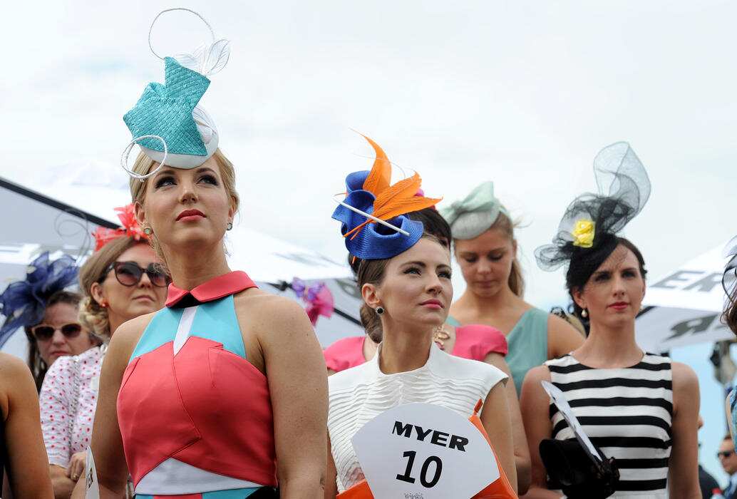 Models line up to compete during the Fashion on the fields event at the Melbourne Cup Day at Flemington racecourse, in Melbourne, Tuesday, Nov. 4, 2014. (AAP Image/Joe Castro) NO ARCHIVING, EDITORIAL USE ONLY