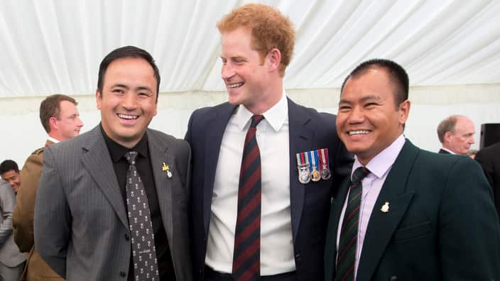 Prince Harry poses for photograph with Kushal Limbu, right, Gurkha rifleman and double gold medallist at the first Invictus Games