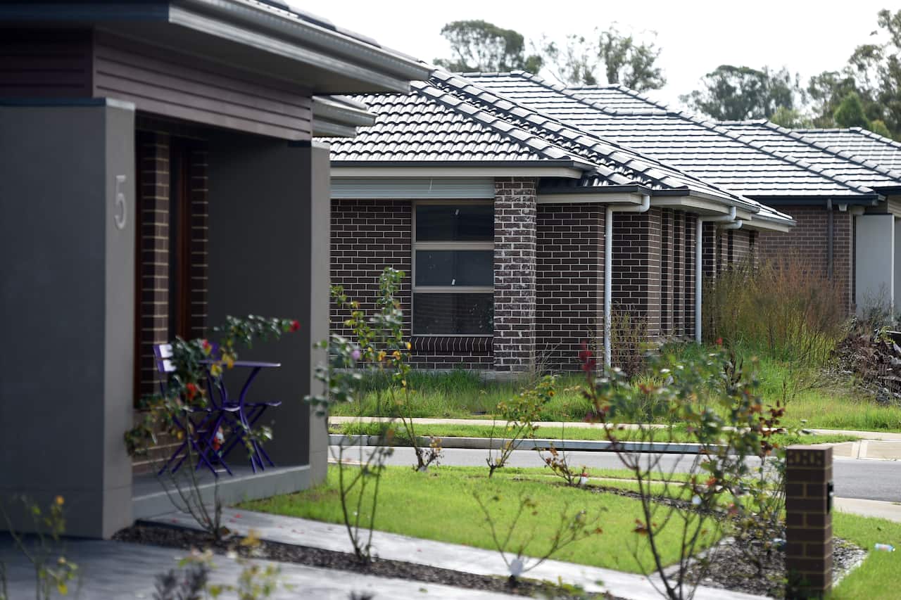 New properties line the street in a housing precinct in Sydney on Sunday, May 3, 2015. (AAP Image/Paul Miller) NO ARCHIVING