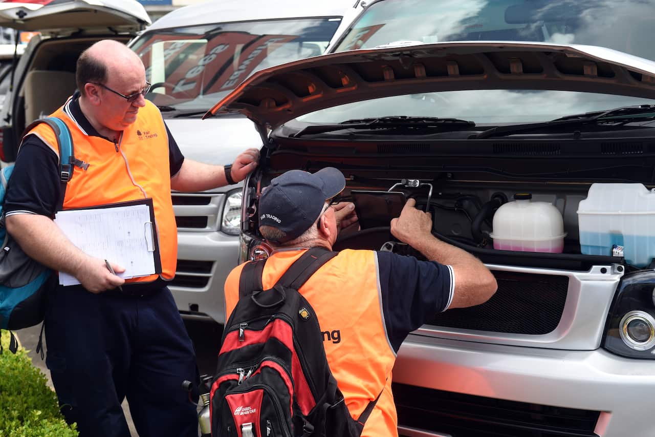 Fair Trading NSW officers inspect a vehicle at Edward Lees Imports in Sydney      