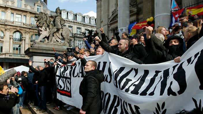  A water cannon has been used to quell rowdy protesters in Brussels following Tuesday's attacks. (AAP) 
