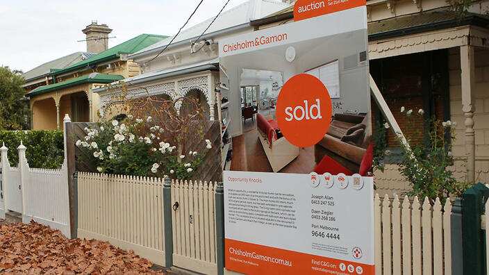 A house with a sold sign in Melbourne, Monday, May 7, 2012