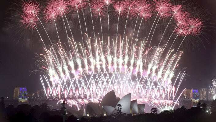 Fireworks explode over the Sydney Opera House and Harbour Bridge as New Year's celebrations are underway in Sydney, Australia,