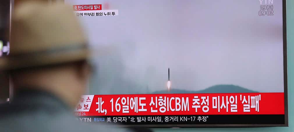 A man watches a TV news program reporting about North Korea's missile firing with at Seoul Train Station in Seoul, April 29, 2017.