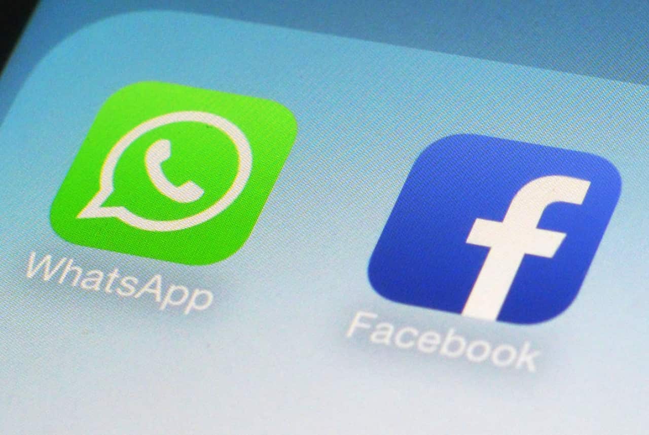 FILE - This Feb. 19, 2014, file photo, shows WhatsApp and Facebook app icons on a smartphone in New York.