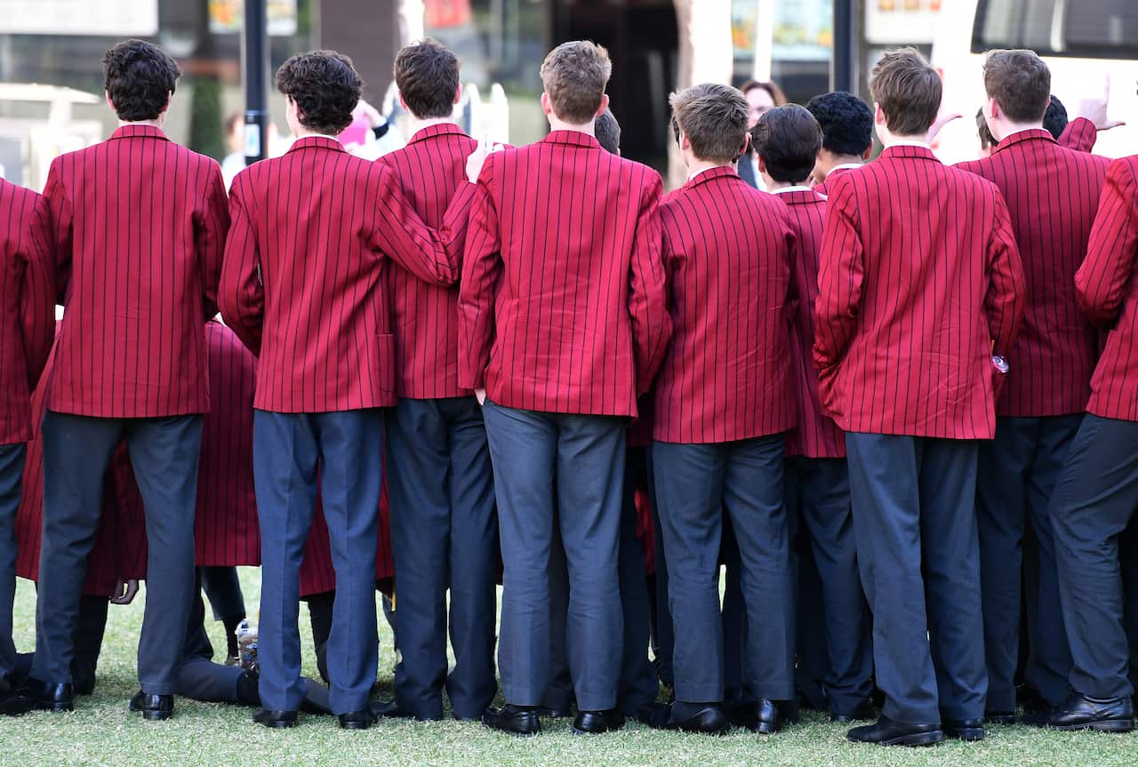 Boys from a private high school are pictured in Brisbane, Friday, July 28, 2017. (AAP Image/Dan Peled) NO ARCHIVING
