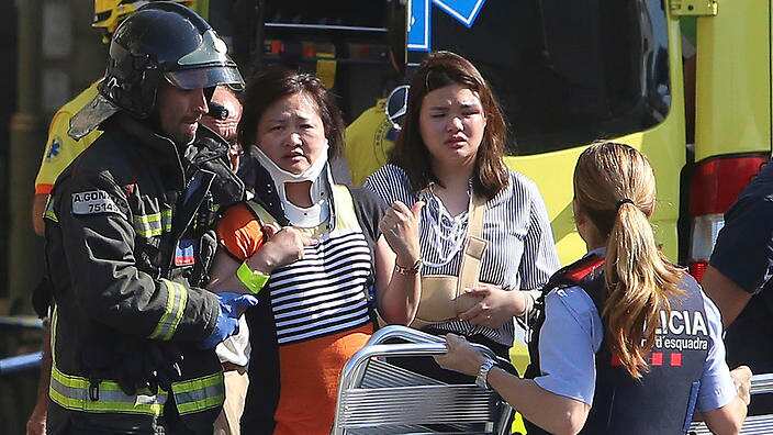Injured people are treated in Barcelona, Spain