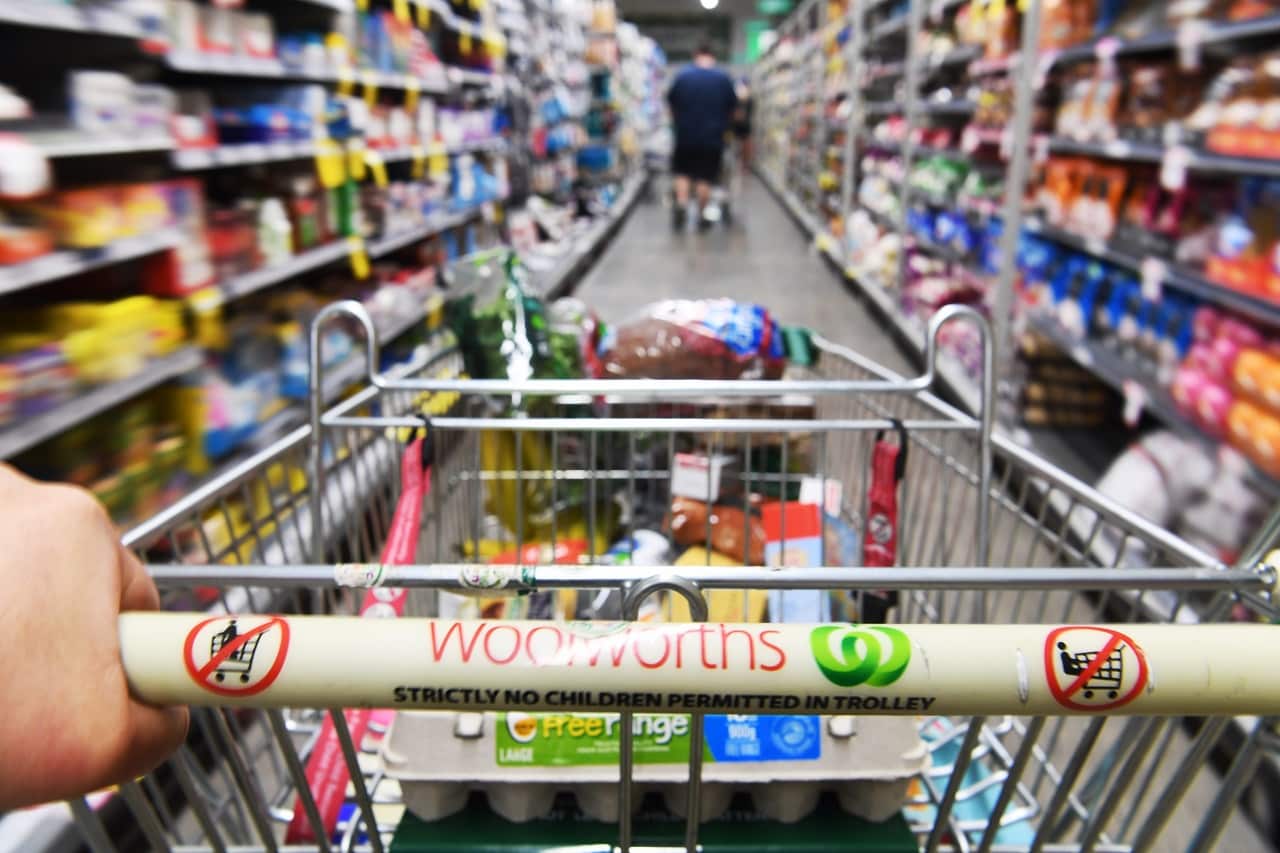 A shopping trolley is seen alongside available perishable goods in a supermarket in Sydney.