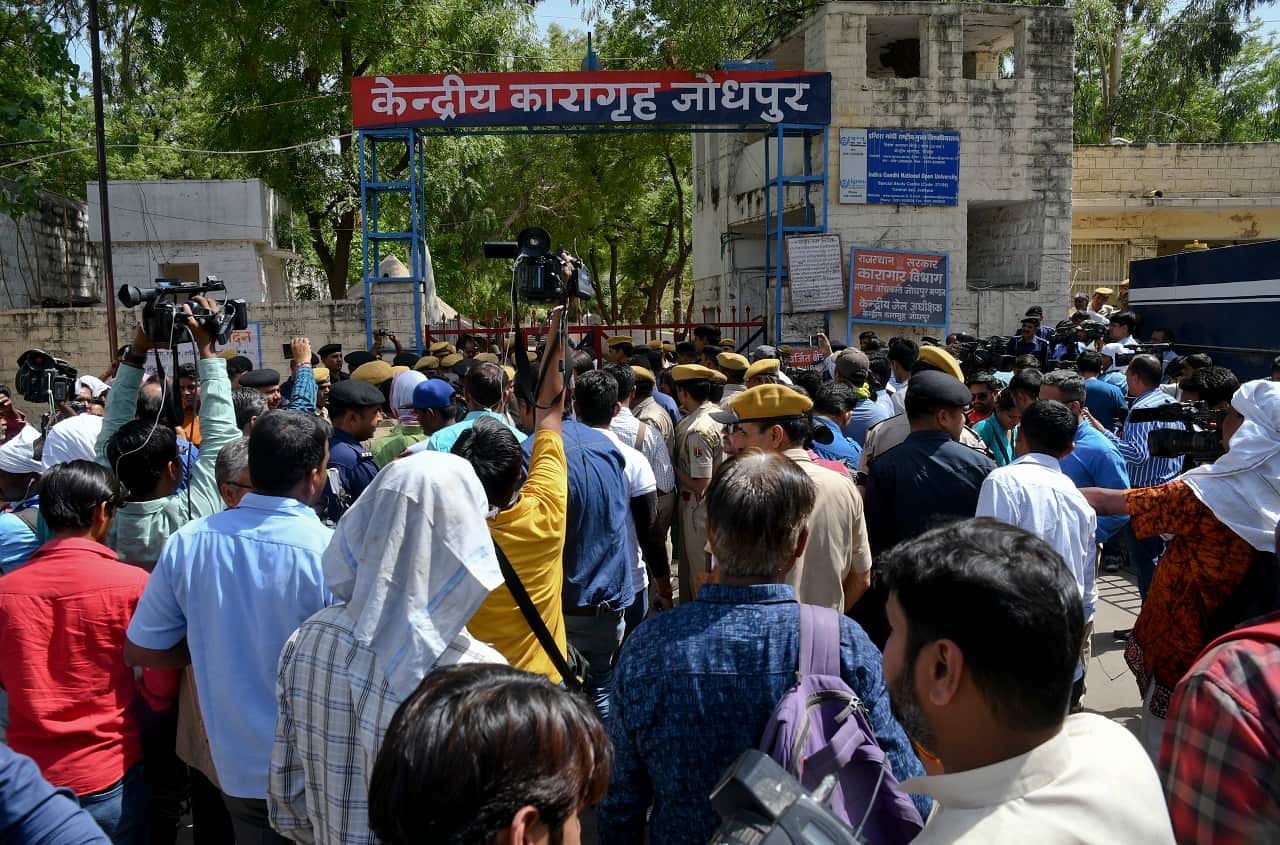 A crowd stand outside the Central Prison where spiritual guru Asaram Bapu is held after an Indian court pronounced verdict on him in Jodhpur, India.