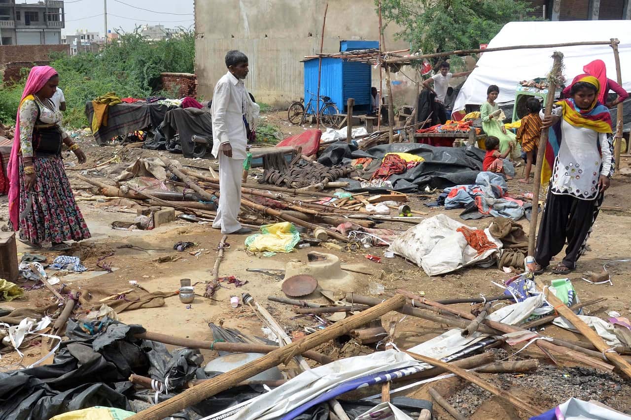 Residents stand amidst their damaged houses  after a massive storm, near Bharatpur district of Rajasthan, India 03 May 2018.