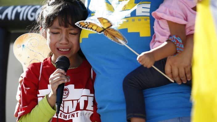 Akemi Vargas, 8, cries as she talks about being separated from her father during an immigration family separation protest.