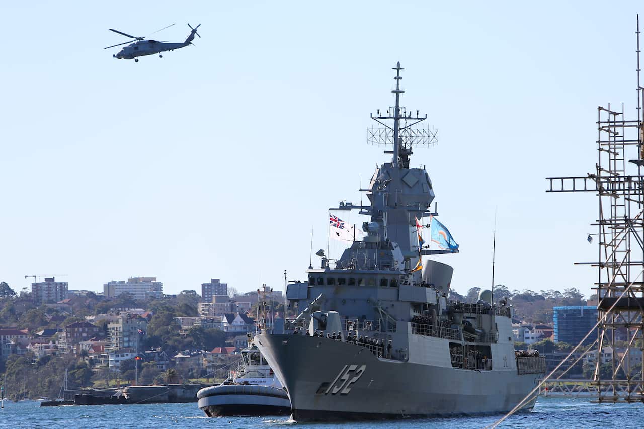 HMAS Warramunga and her crew as she arrives at Garden Island in Syndey
