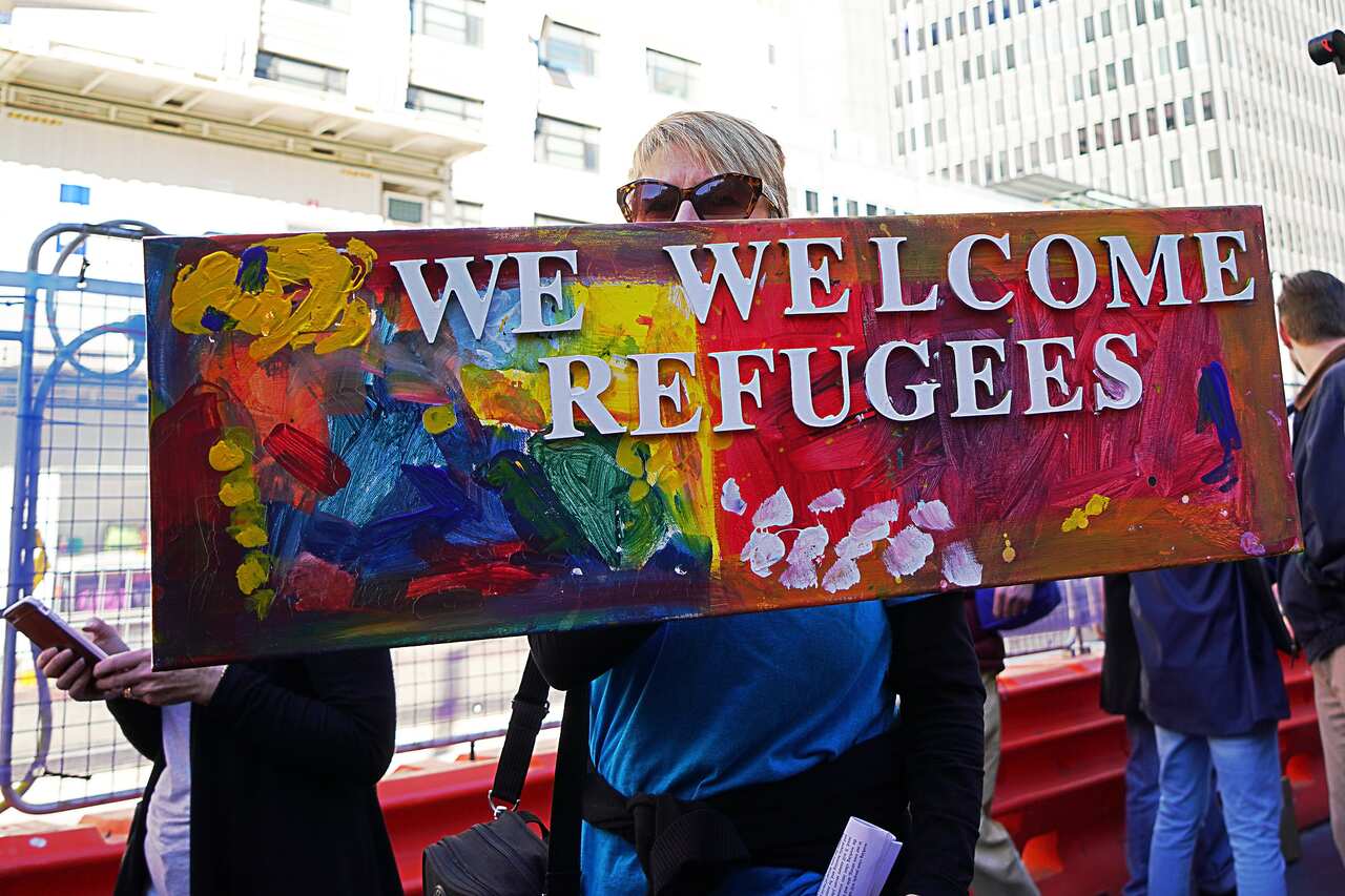 Rallygoers protest during the Evacuate Manus and Nauru Protest - 'Five Years Too Long, 12 Deaths Too Many' Protest at Town Hall in Sydney on Saturday, July 21, 2018. Refugee Action Coalition (RAC) Sydney organised a protest against mandatory offshore dete