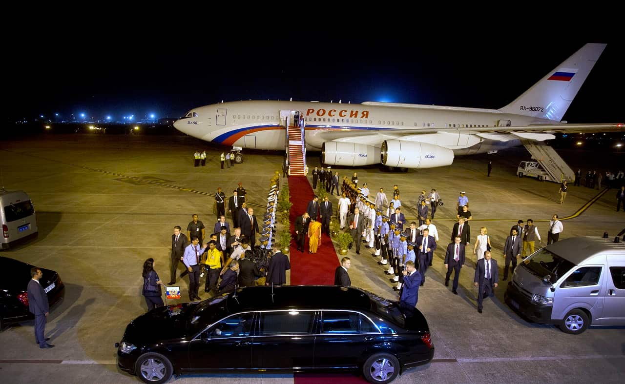 Russian President Vladimir Putin, center left, is received by Indias External Affairs Minister Sushma Swaraj