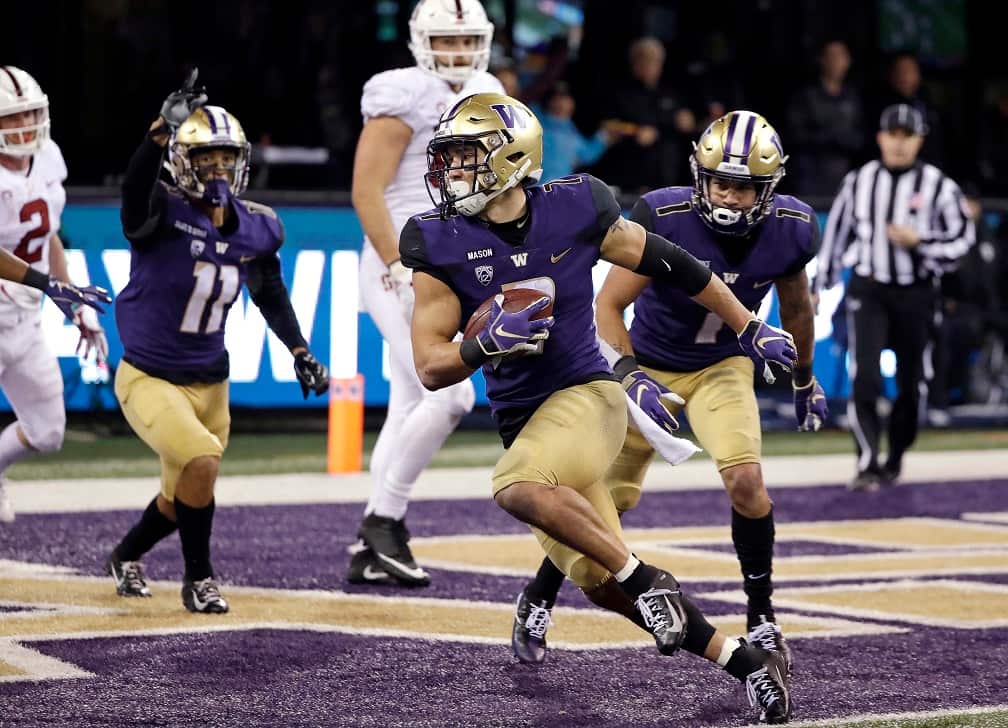 Washington's Taylor Rapp (7) comes down with the ball after intercepting a Stanford pass in the end zone