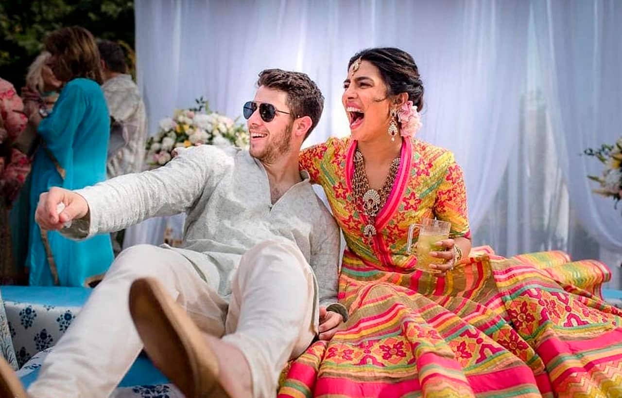 Bollywood actress Priyanka Chopra and Nick Jonas celebrate during their mehndi ceremony at Umaid Bhawan in Jodhpur, Dec. 1, 2018. 