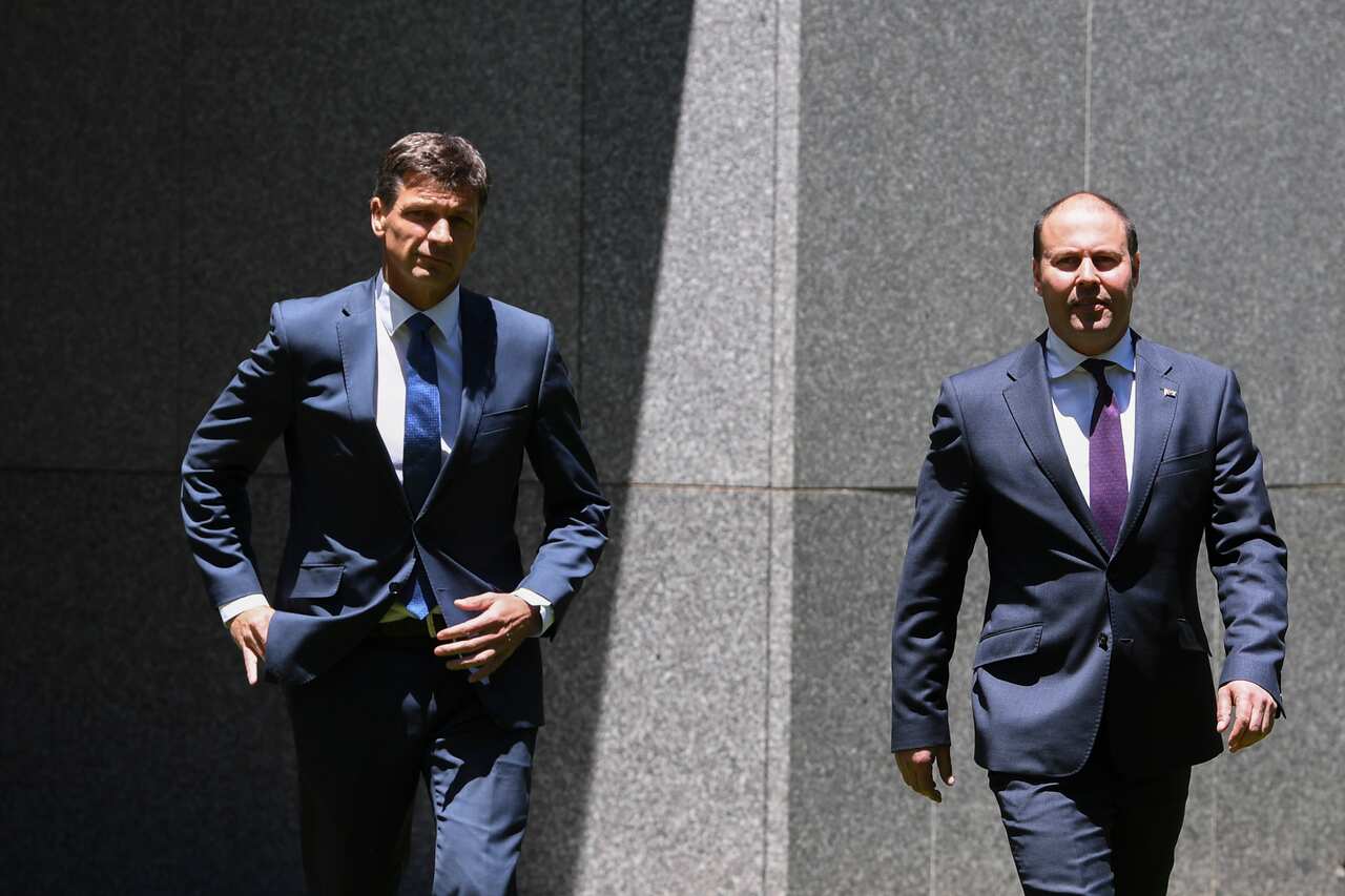 Australian Federal Treasurer Josh Frydenberg (right) and Australian Energy Minister Angus Taylor arrive to speak to the media during a press conference