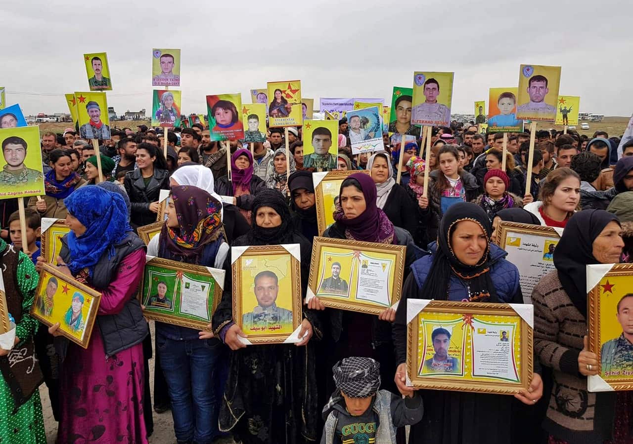 Kurdish protestors near US coalition base near Kobani, Syria