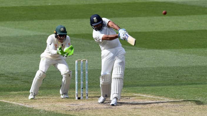 Rohit Sharma of India (right) bats on day two of the Boxing Day Test match between Australia and India at the MCG in Melbourne.