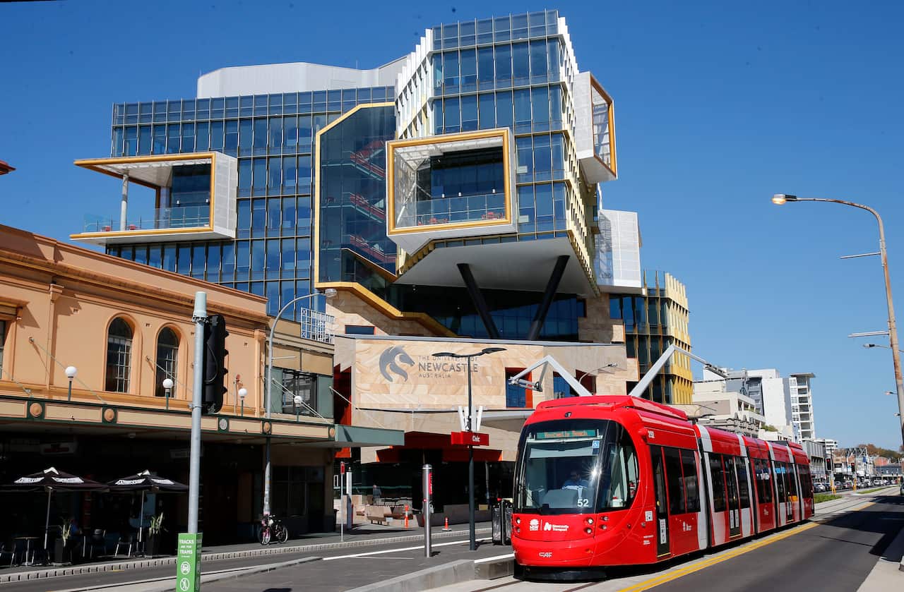 A new Newcastle tram is seen on Hunter street past Civic Theatre and the University of Newcastle Hunter street Campus.