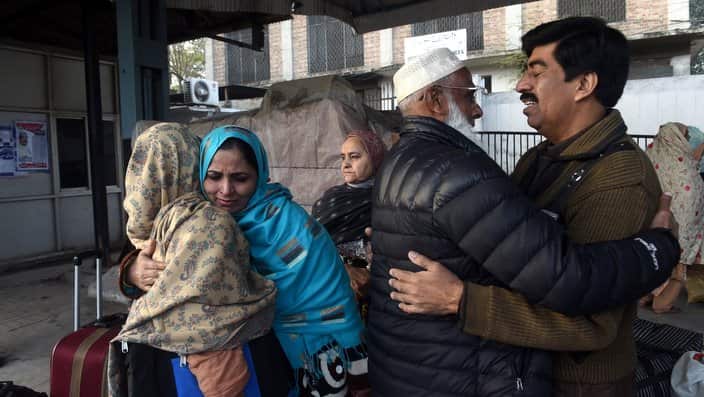 Indian passengers prepare to board a train after resuming operations of Samjhota Express, the train service between Pakistan and India. EPA/RAHAT DAR