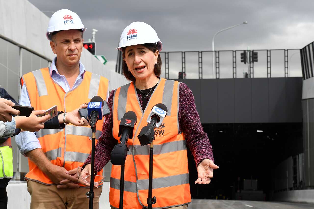 NSW Premier Gladys Berejiklian (right) and Minister for Transport and Roads Andrew Constance speak to the media at the almost-completed M4 WestConnex tunnels in Sydney, Thursday, April 11, 2019. (AAP Image/Dylan Coker) NO ARCHIVING