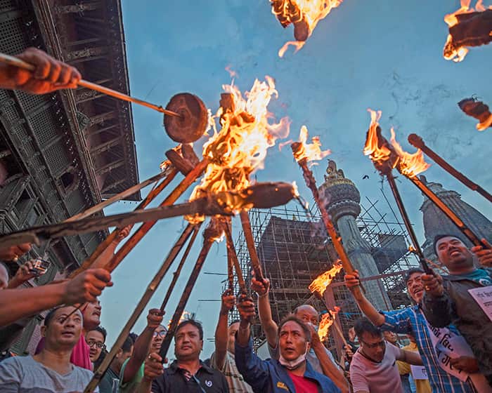 epa07647981 Nepalese indigenous Newar community stage a torch protest rally against the Guthi bill in Patan city, Nepal, 14 June 2019.