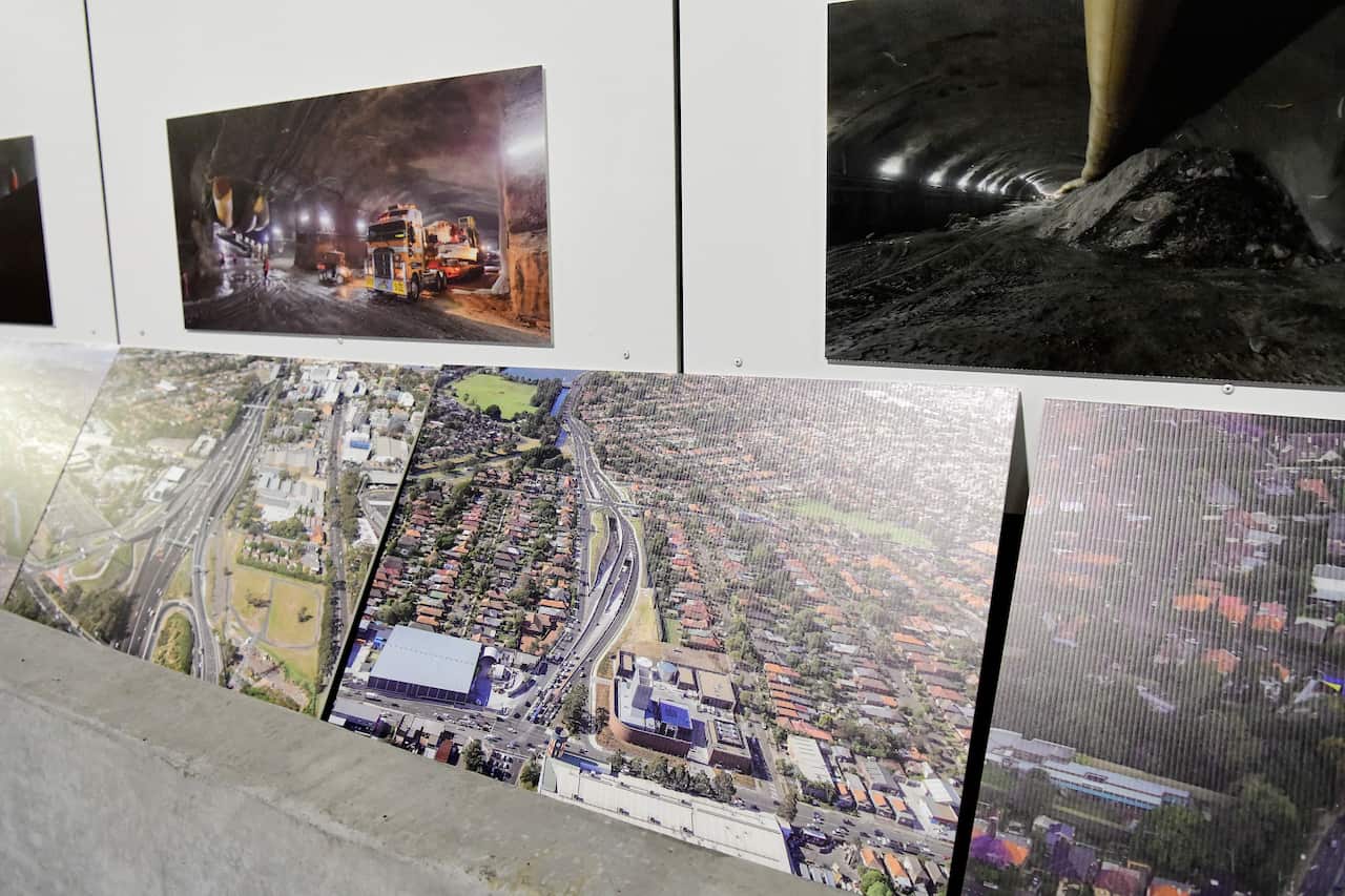Photographs of contraction progress are displayed during an  community event to inspect the new M4 WestConnex tunnels in Homebush, Sydney, 