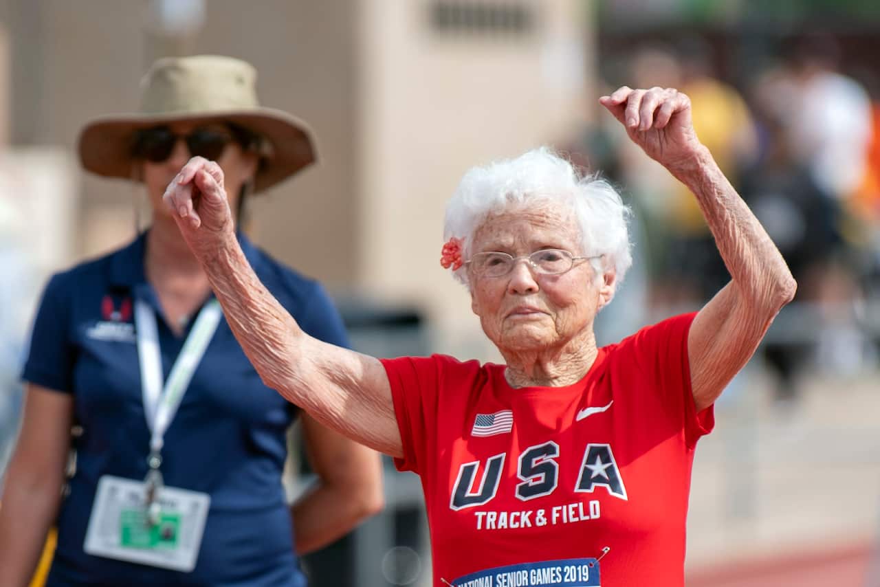 n this photo provided by the National Senior Games Association, 103-year-old Julia Hawkins, of Baton Rouge, La., celebrates after completing the 50-meter dash at the 2019 National Senior Games in Albuquerque, N.M., Monday, June 17, 2019. (Brit Huckabay/NS