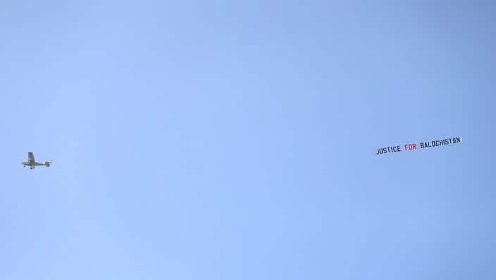 A plane overheard with a banner reading 'Justice For Balochistan' during the ICC Cricket World Cup group stage match at Headingley, Leeds.