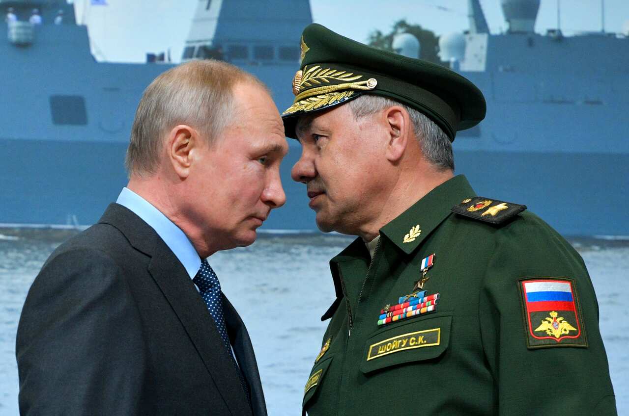 Russian President Vladimir Putin, left, and Russian Defense Minister Sergei Shoigu during a visit a shipyard in St. Petersburg, Russia.