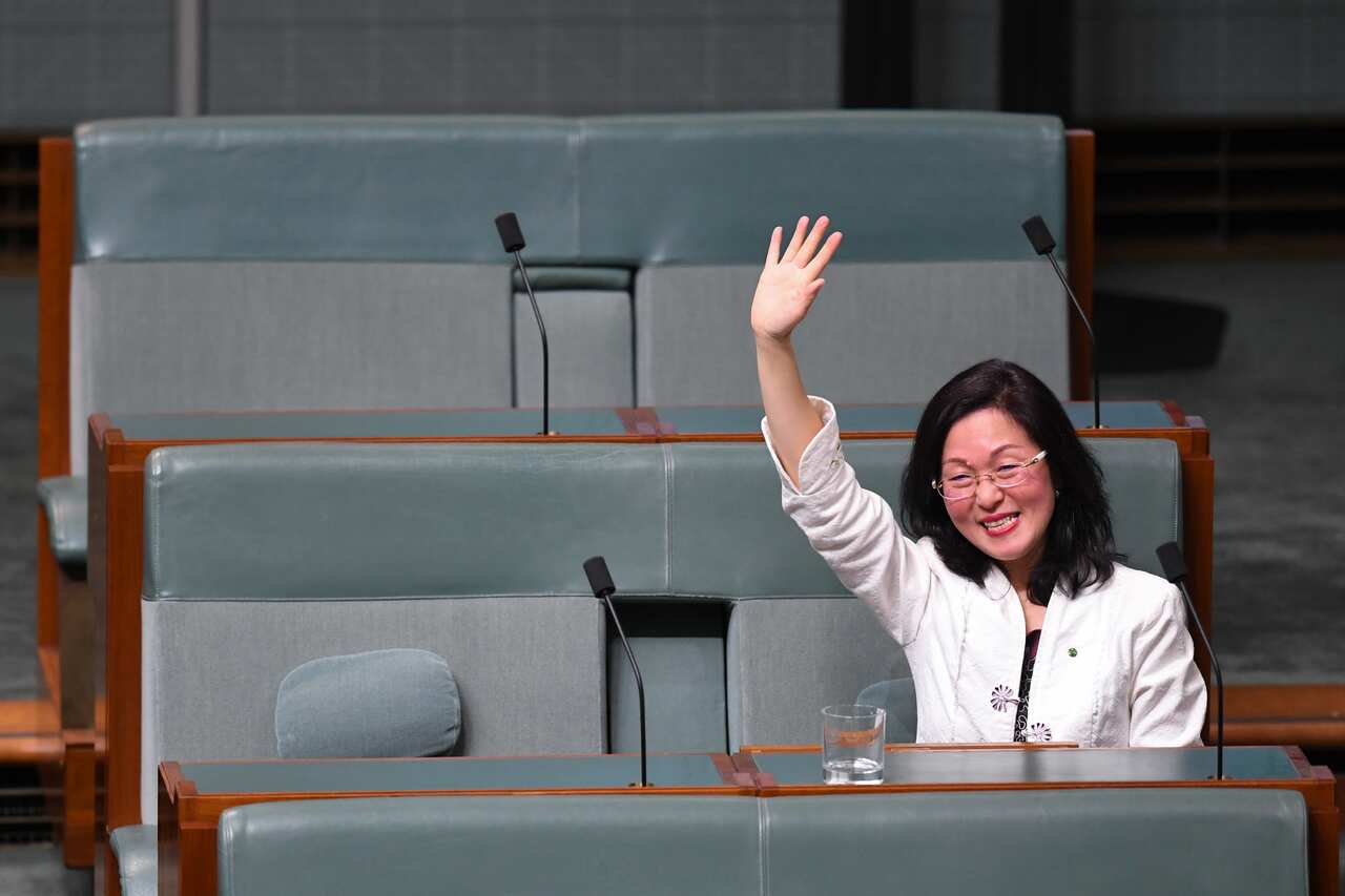 Gladys Liu waves after delivering her maiden speech in the House of Representatives at Parliament House in 2019.