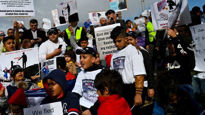 Children are seen attending a rally by Temporary Protection Visa (TPV) and Safe Haven Enterprise Visa (SHEV) holders outside Parliament House in Canberra, Monday, 29 July, 2019. (AAP Image/Lukas Coch)