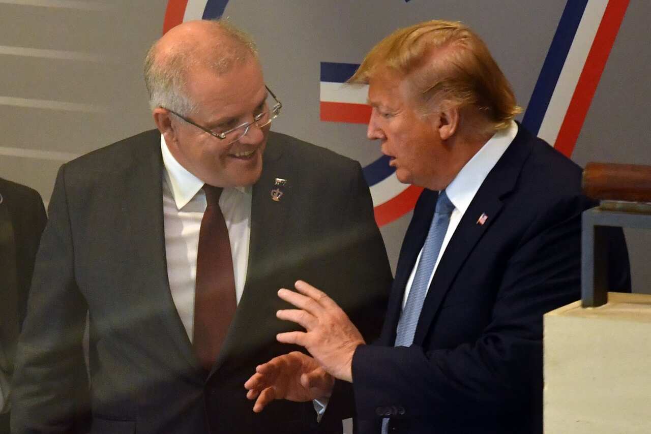 U.S. President Donald Trump and Australia's Prime Minister Scott Morrison leave together after a meeting during the G7 Summit in the town of Biarritz, 800km south of Paris in France, Sunday, August 25, 2019.  (AAP Image/Mick Tsikas) NO ARCHIVING
