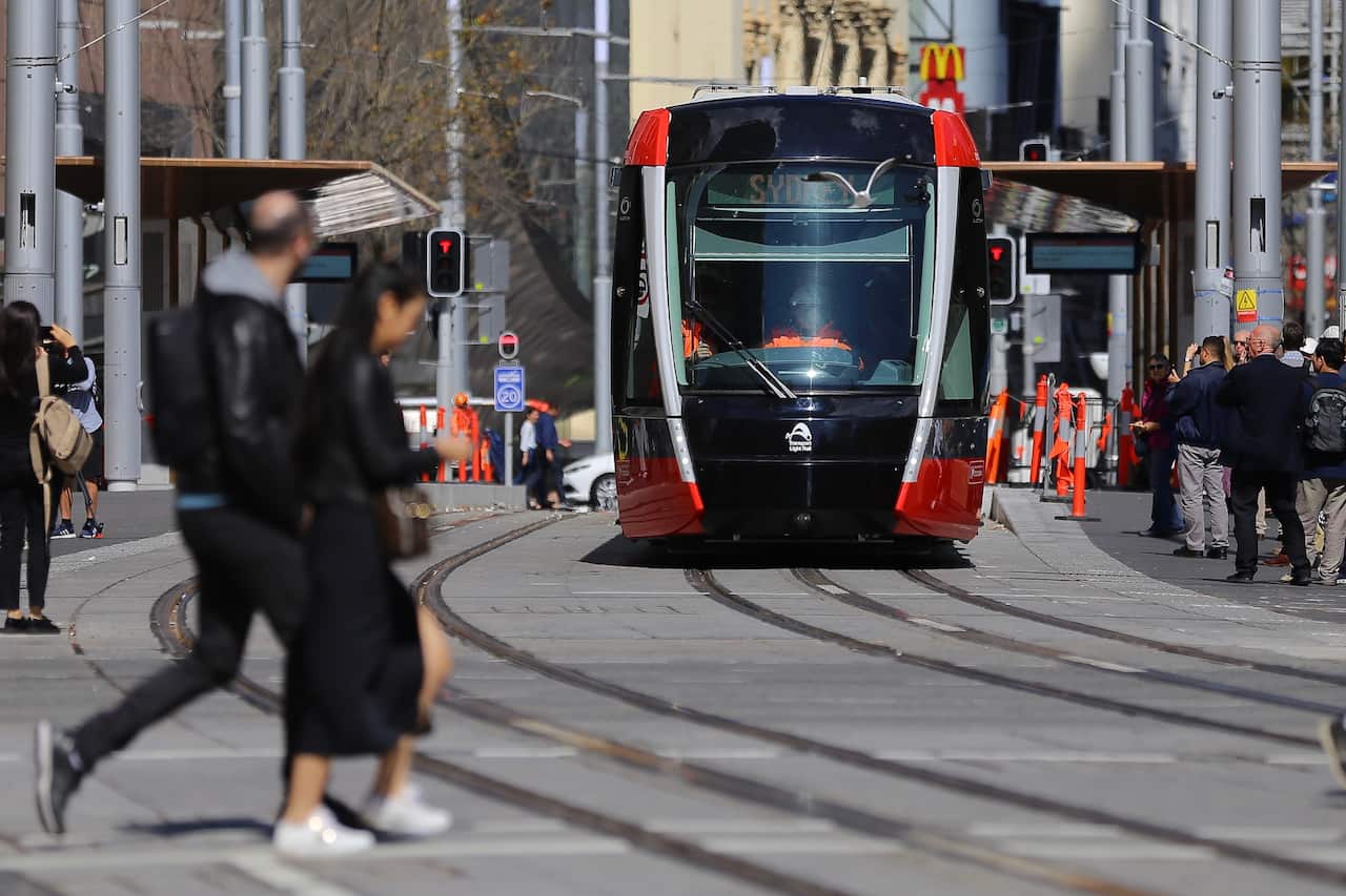 Premier Gladys Berejiklian and Minister for Transport Andrew Constance ride on the first light rail vehicle test from Town Hall to Circular Quay in Sydney, Wednesday, August 28, 2019. (AAP Image/Steven Saphore) NO ARCHIVING