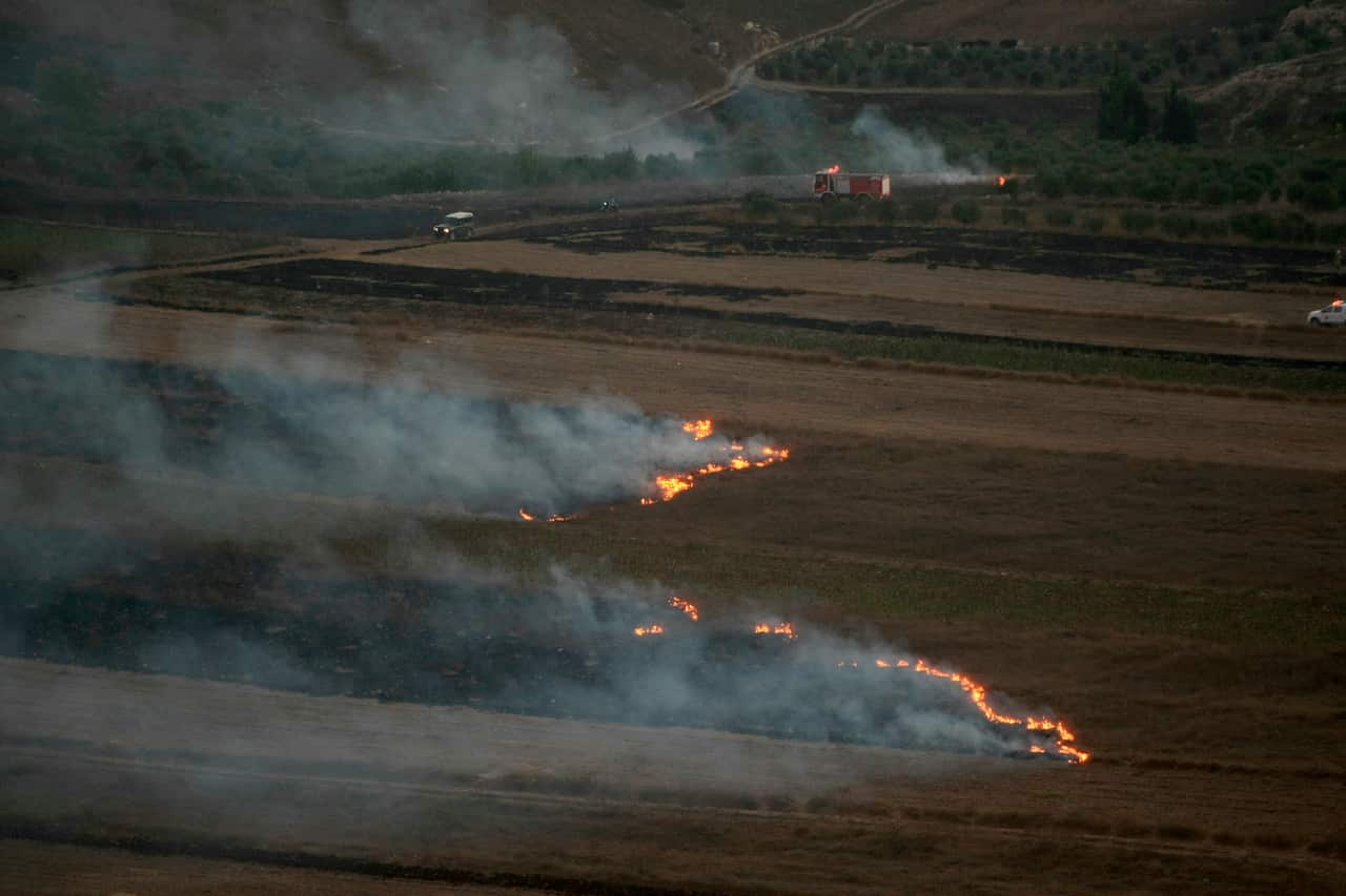 Flames and smoke rise from where Israeli army shells that landed in the southern Lebanese border village of Maroun Al-Ras, Lebanon, Sunday, Sept. 1, 2019. Hezbollah militants fire a barrage of anti-tank missiles into Israel, prompting a reprisal of heavy 