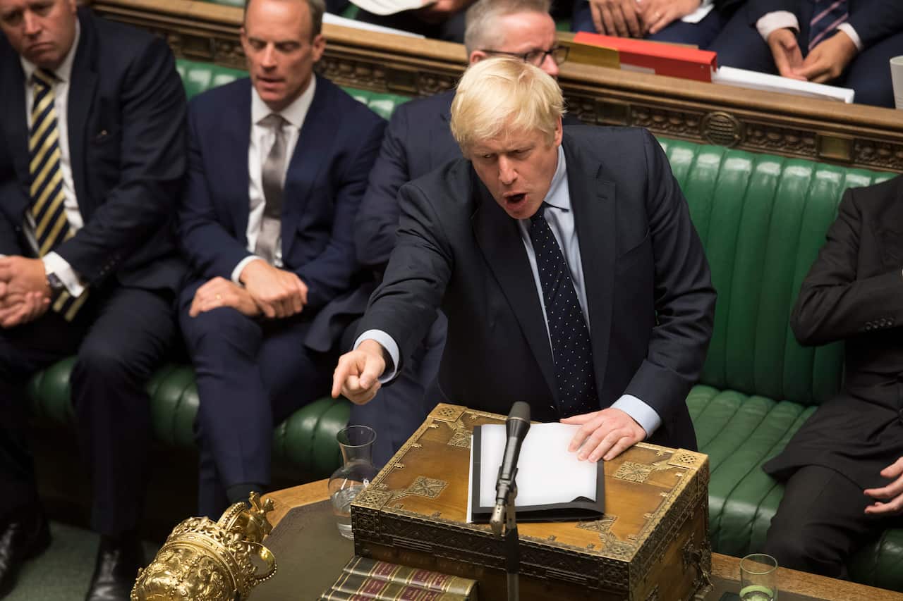 A handout photo made available by the UK Parliament shows British Prime Minister Boris Johnson in debate