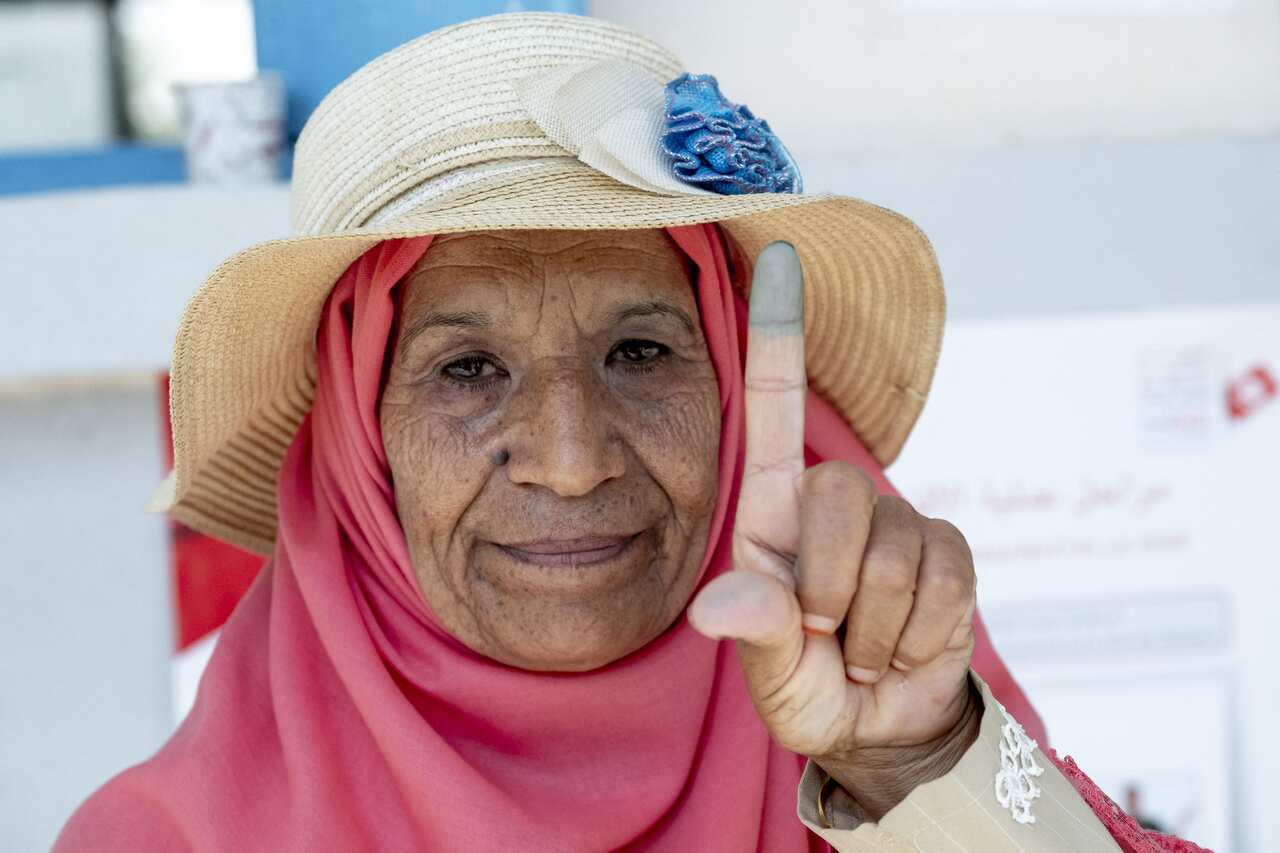 Tunisians voter cast their ballot for presidential election at a polling station in Sidi Thabet