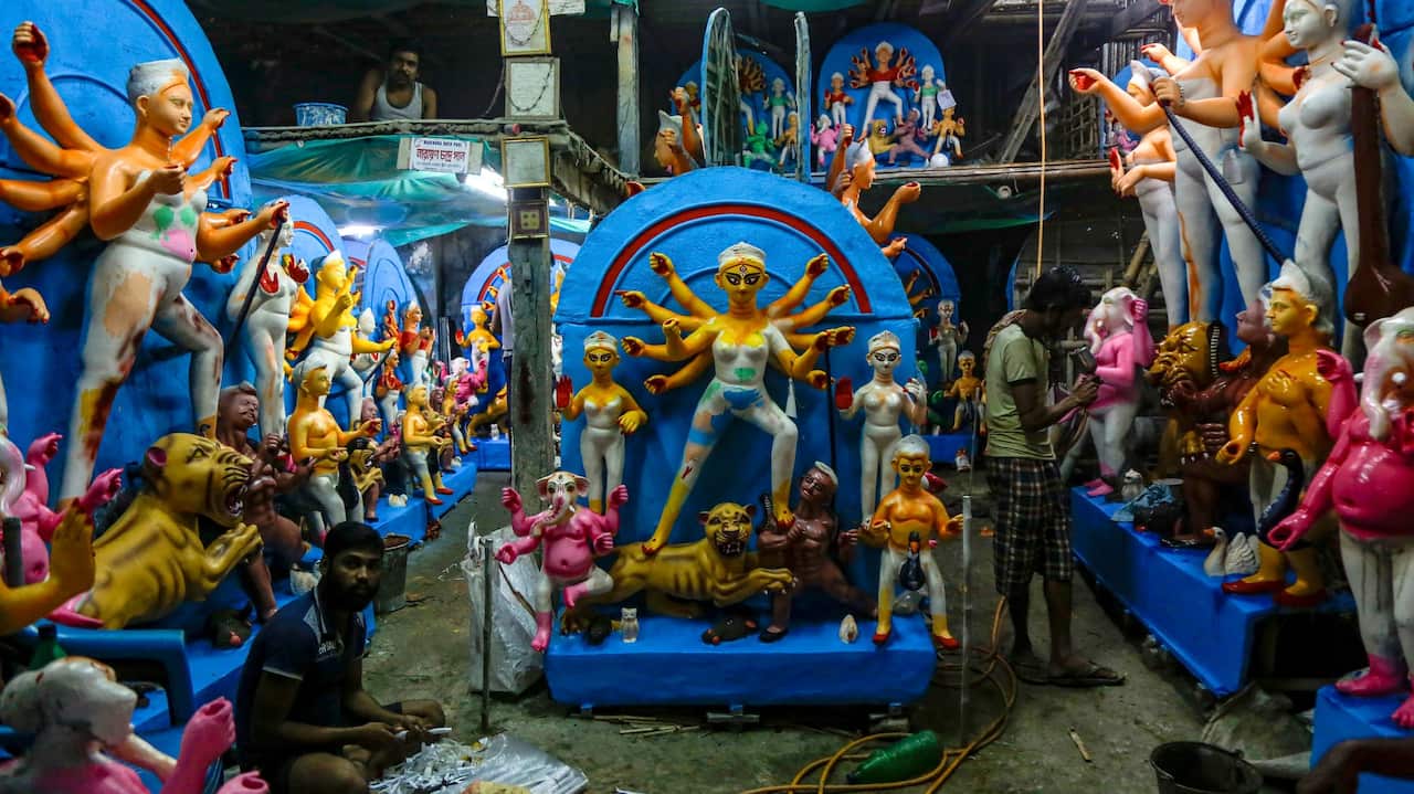 Artisans prepare clay idols of Hindu goddess Durga at a makeshift studio in Kolkata, India, Wednesday, Sept. 25, 2019. The idols are being made for worship venues ahead of Durga Puja festival that begins first week of October. (AP Photo/Bikas Das)