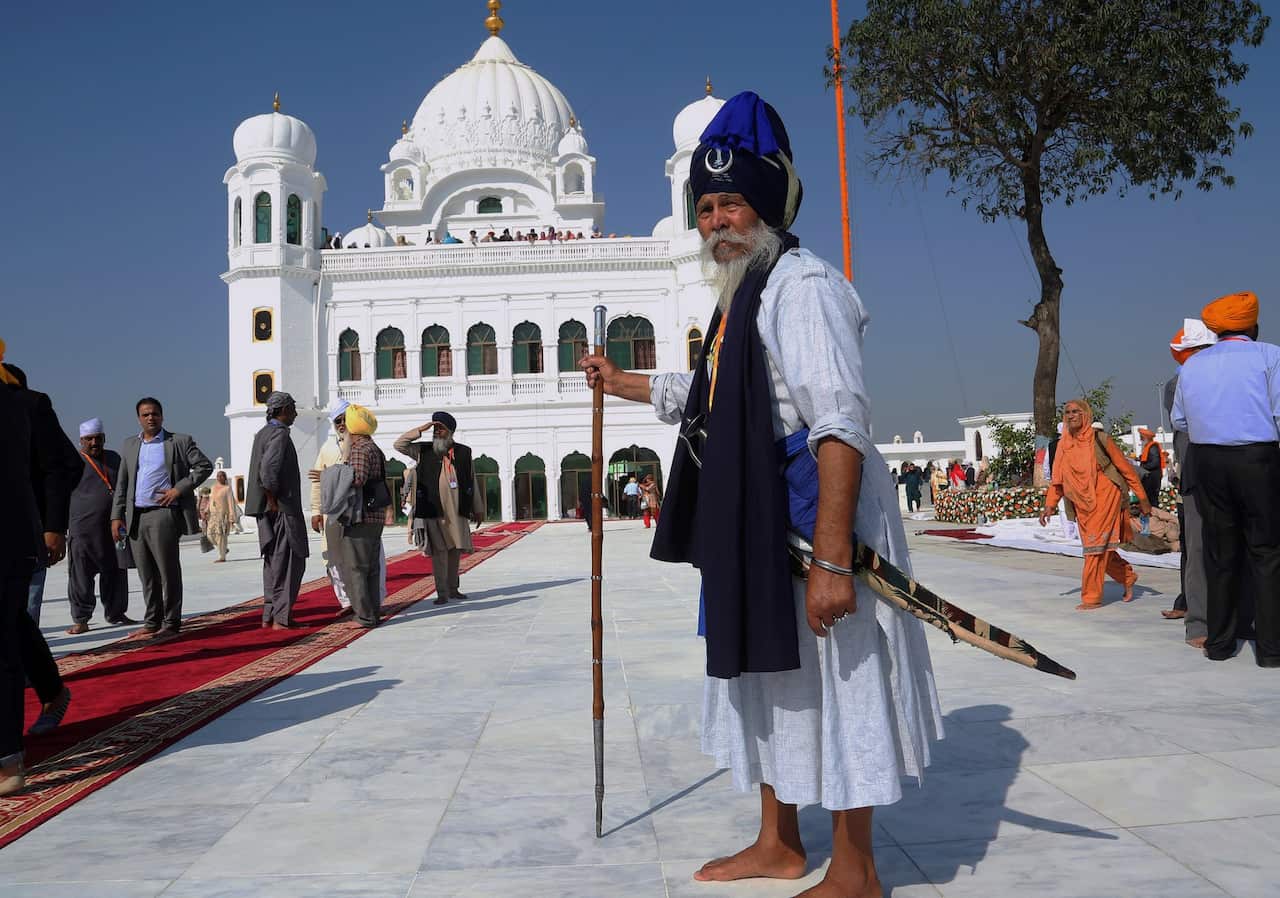Sikh pilgrims visit the shrine of their spiritual leader Guru Nanak Dev, at Gurdwara Darbar Sahib in Kartarpur, Pakistan. (AP Photo/K.M. Chaudary)