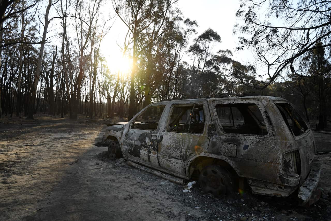 A burnt out car is seen in Torrington, near Glen Innes, Sunday, November 10, 2019. There are more than 80 fires burning around the state, with about half of those uncontained. (AAP Image/Dan Peled) NO ARCHIVING