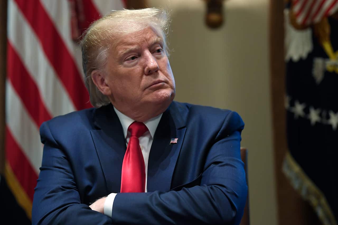 President Donald Trump listens during a meeting in the Cabinet Room of the White House in Washington, Friday, Nov. 22, 2019