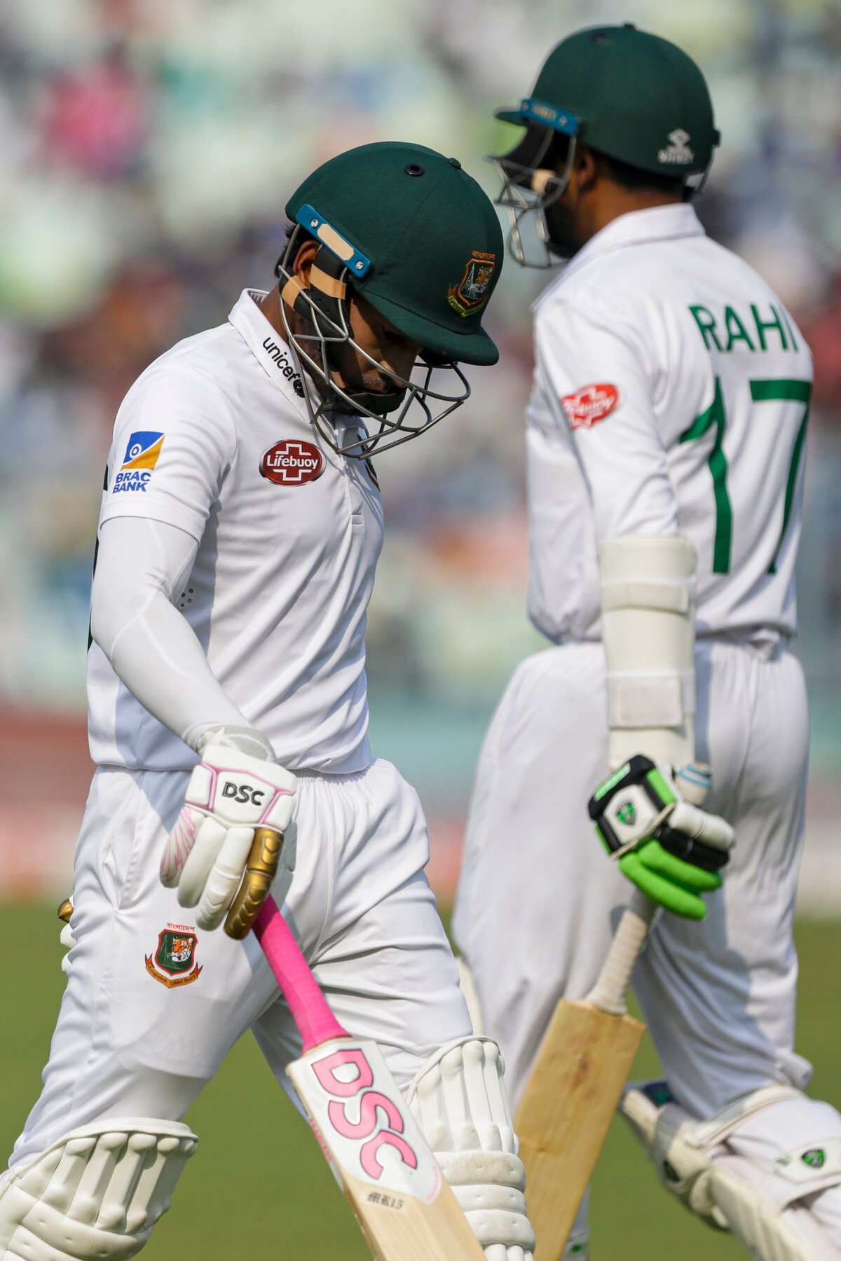 Bangladesh's Mushfiqur Rahim walks back to pavilion after his dismissal during the third day of the second test cricket match between India and Bangladesh, in Kolkata, India, Sunday, Nov. 24, 2019. (AP Photo/Bikas Das)