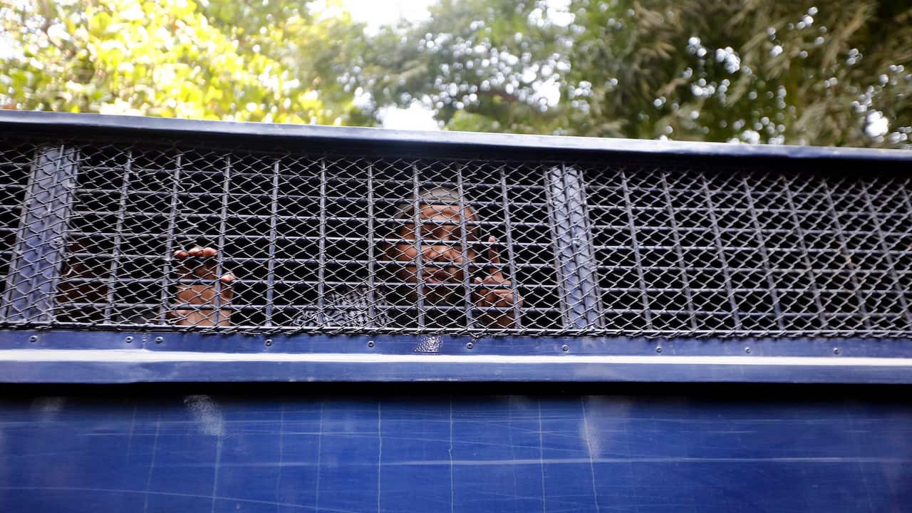 Suspects react from the prison van during the verdict day of Holey Artisan Attack case in Dhaka, Bangladesh, 27 November 2019.