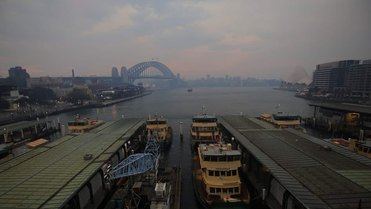 Smoke haze from bushfires in New South Wales blankets the CBD and Sydney Opera House in Sydney