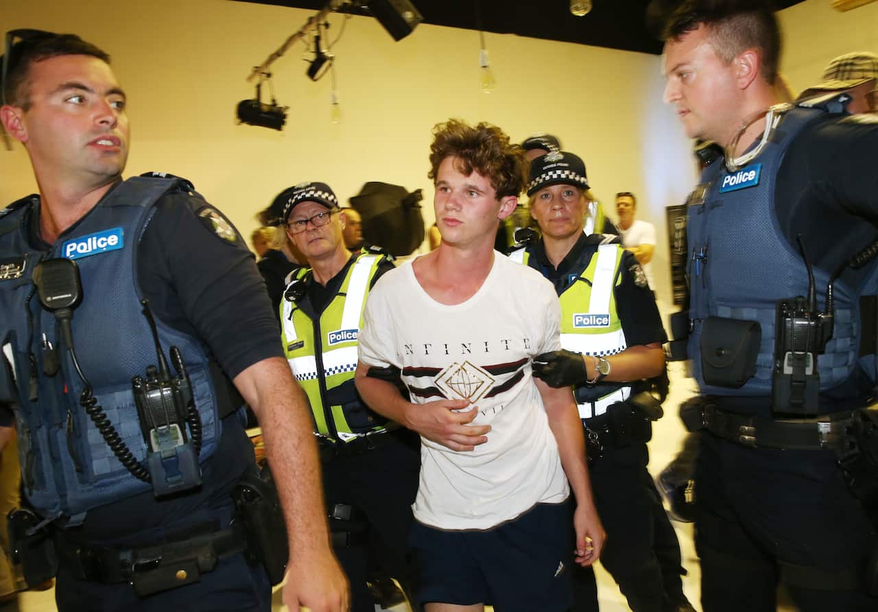A left-wing activist is arrested after smashing an egg over the head of Senator Fraser Anning after he addressed a political meeting in Moorabbin, Melbourne