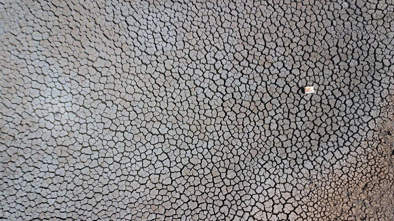 An aerial view of a dried up dam at Cottonvale apple orchard, outside the drought ravaged town of Stanthorpe,  south west of Brisbane, Friday, October 4, 2019