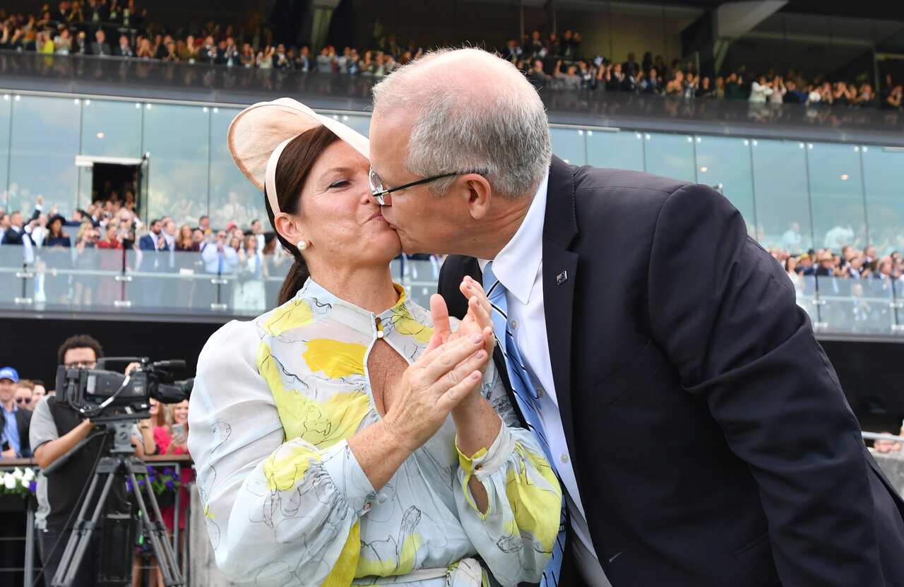 Prime Minister Scott Morrison kisses wife Jenny after watching champion racehorse Winx win the Queen Elizabeth Stakes at Royal Randwick in Sydney