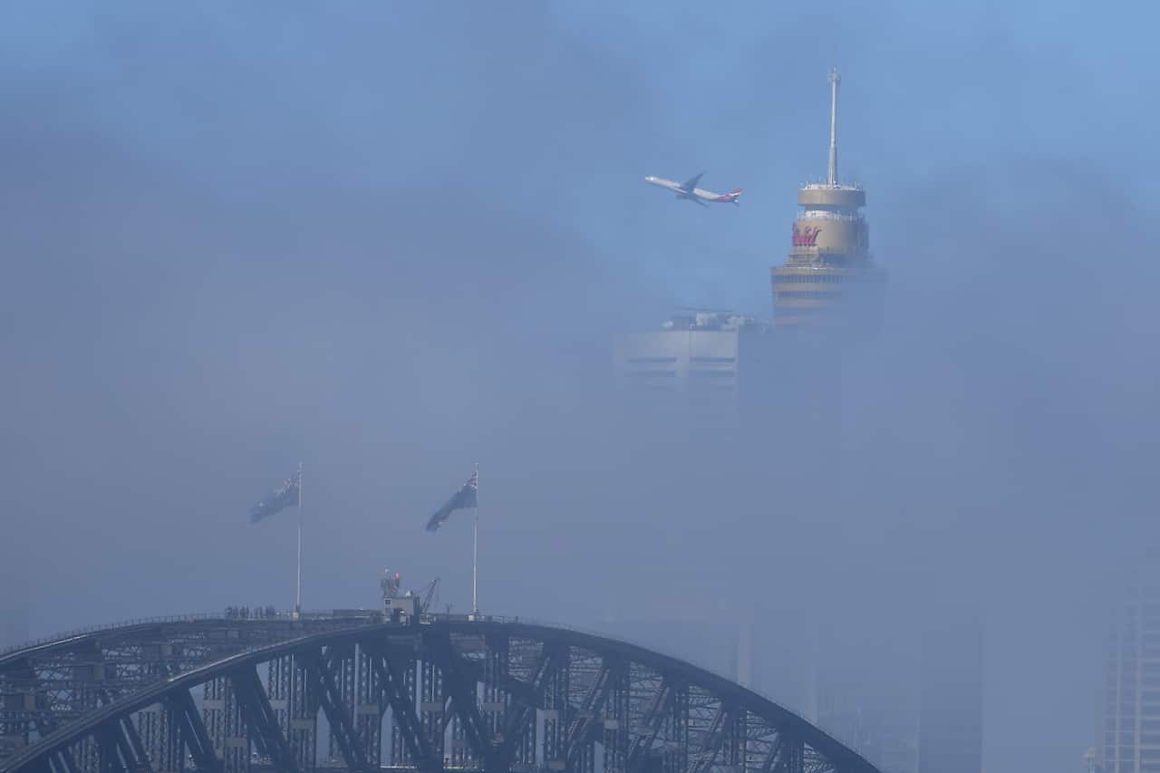 heavy fog is seen shrouding the city skyline in Sydney, Wednesday, April 3, 2019. (AAP Image/Dan Himbrechts) NO ARCHIVING